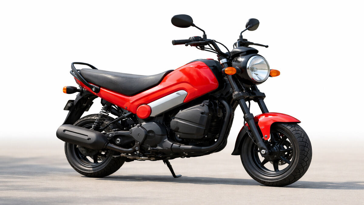 Honda Navi mini bike in red colour parked on clean background