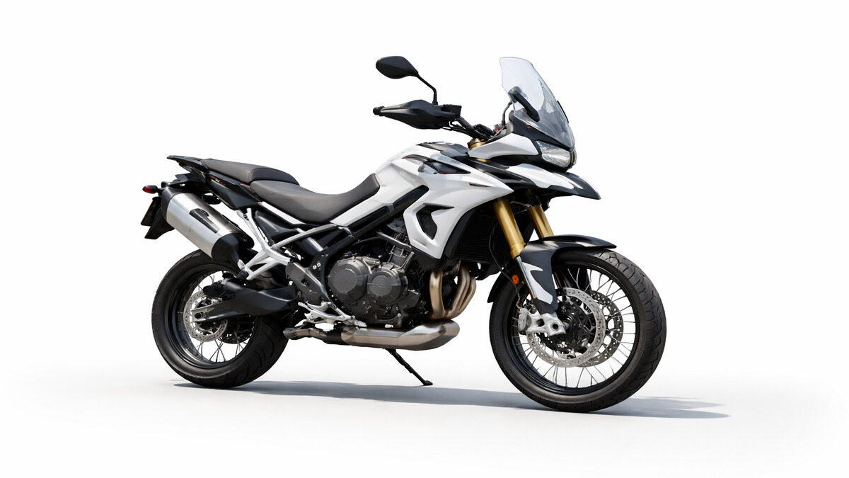Triumph Tiger 900 adventure motorcycle side profile on plain background