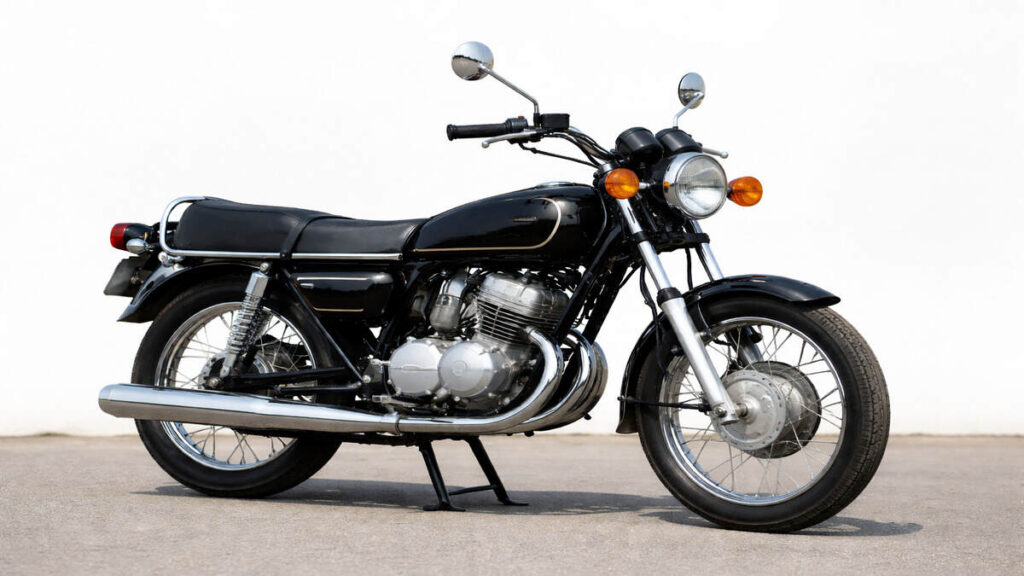 Black Yamaha Rajdoot 350 classic motorcycle parked on road