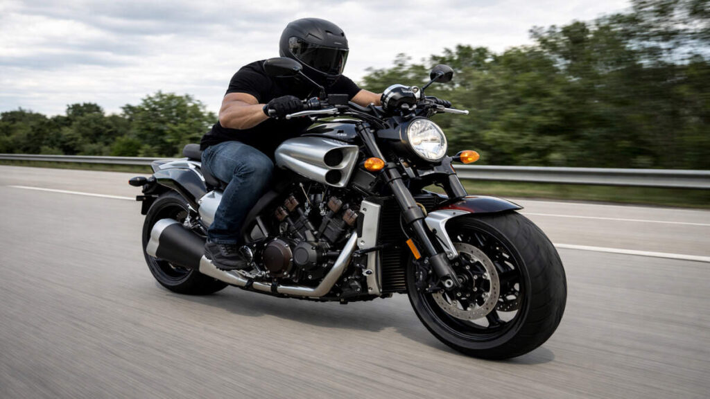 Rider riding Yamaha VMAX on open highway showing power and control