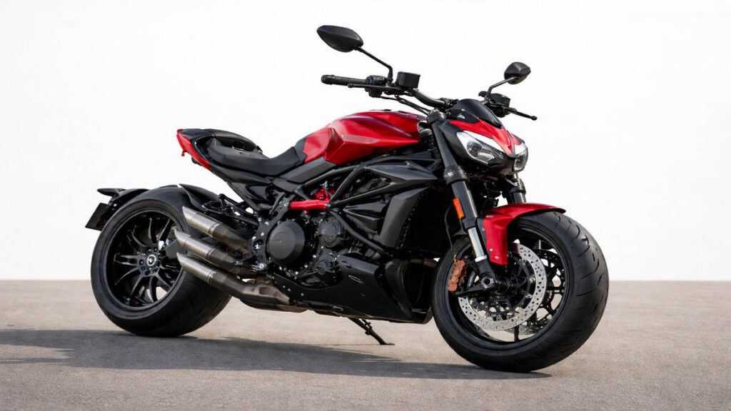Ducati XDiavel V4 motorcycle in red on a plain background in natural daylight