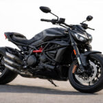 Realistic photo of Ducati XDiavel V4 motorcycle on a plain background in natural daylight