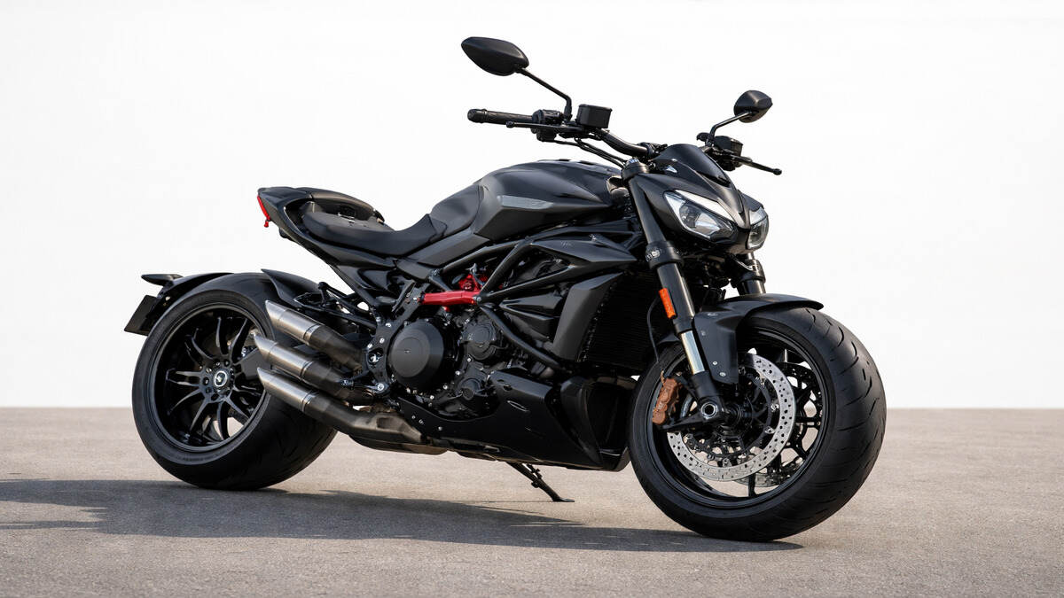 Realistic photo of Ducati XDiavel V4 motorcycle on a plain background in natural daylight